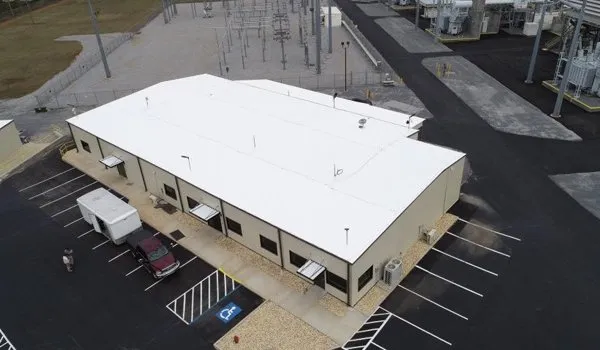 Completed metal roof restoration showing professional coating application and improved roof condition